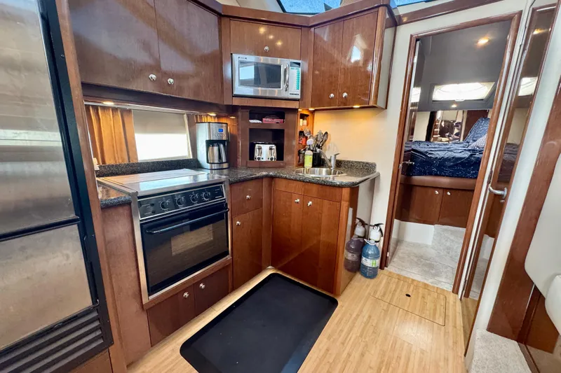 Water Baby Yacht Photos Pics Luxurious kitchen interior of 2007 Carver 43 Motor Yacht with modern appliances.