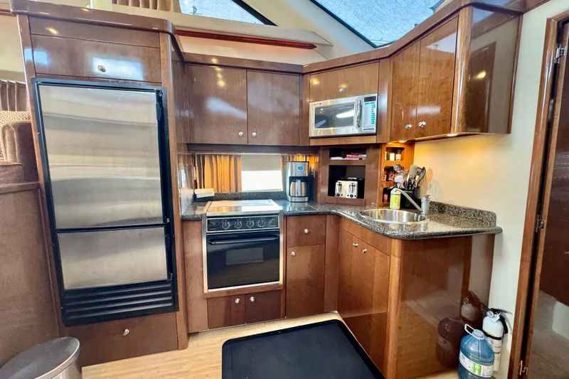 Water Baby Yacht Photos Pics Luxurious kitchen interior of 2007 Carver 43 Motor Yacht with modern appliances.