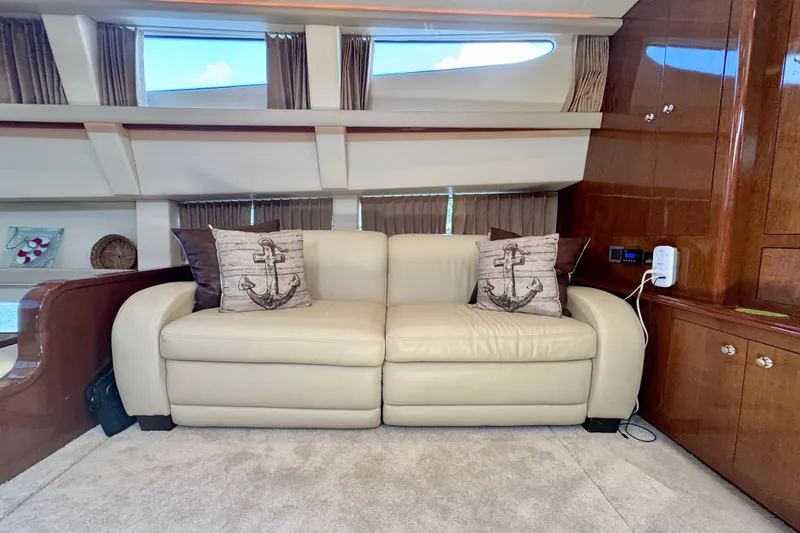 Water Baby Yacht Photos Pics Luxurious interior of 2007 Carver 43 Motor Yacht with cream sofa and nautical decor.