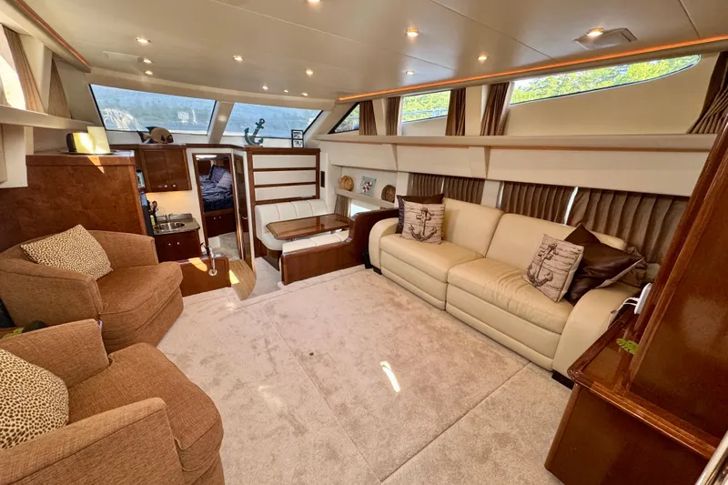 Water Baby Yacht Photos Pics Luxurious interior of 2007 Carver 43 Motor Yacht with plush seating and elegant decor.