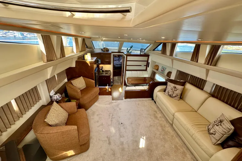 Water Baby Yacht Photos Pics Luxurious interior of 2007 Carver 43 Motor Yacht with plush seating and elegant decor.