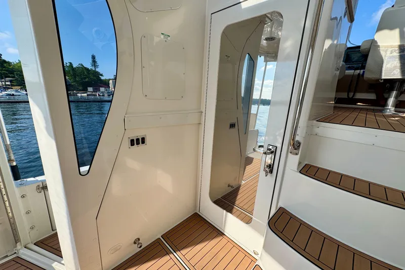 Water Baby Yacht Photos Pics 2007 Carver 43 Motor Yacht interior with teak flooring and water view.