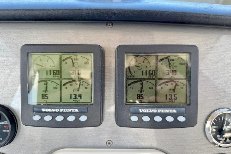 Water Baby Yacht Photos Pics Dashboard of a 2007 Carver 43 Motor Yacht with Volvo Penta gauges displaying engine metrics.