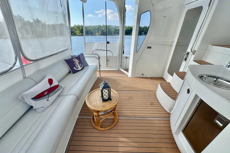 Water Baby Yacht Photos Pics Luxurious 2007 Carver 43 Motor Yacht interior with elegant seating and scenic lake view.