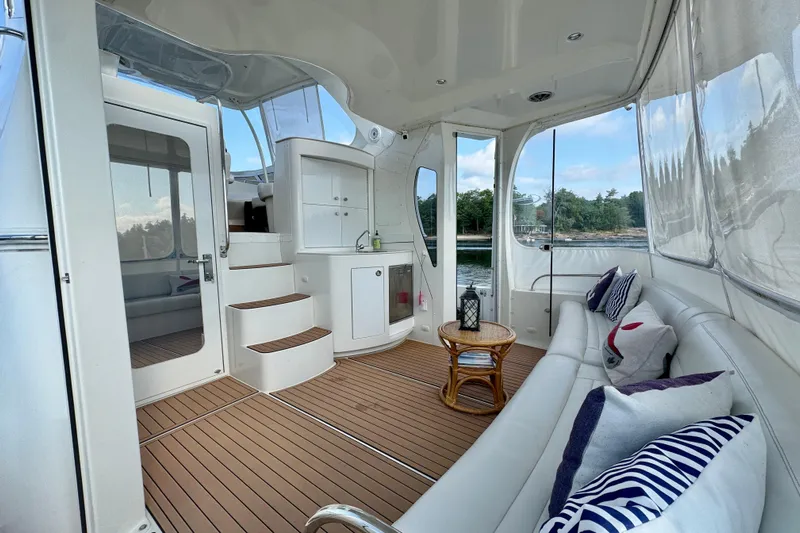 Water Baby Yacht Photos Pics Luxurious interior of 2007 Carver 43 Motor Yacht with elegant seating and scenic views.