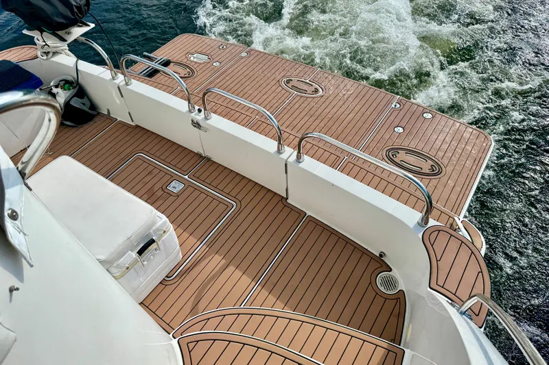 Water Baby Yacht Photos Pics 2007 Carver 43 Motor Yacht deck with teak flooring and stainless steel railings.