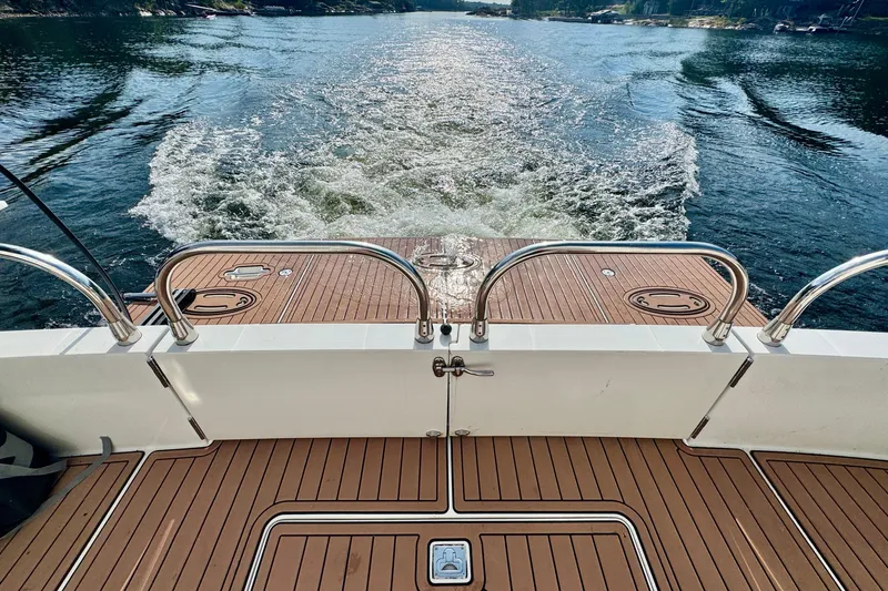 Water Baby Yacht Photos Pics 2007 Carver 43 Motor Yacht cruising on a serene lake, showcasing its elegant deck design.