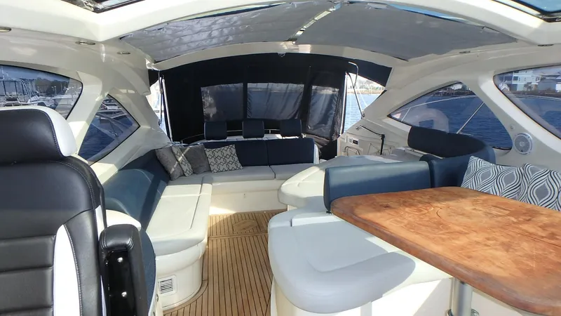 My Way Yacht Photos Pics Luxurious interior of 2006 Azimut Atlantis 55 yacht with elegant seating and wooden table.