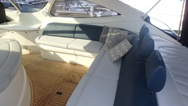 My Way Yacht Photos Pics Luxurious interior of 2006 Azimut Atlantis 55 yacht with elegant seating and wooden flooring.