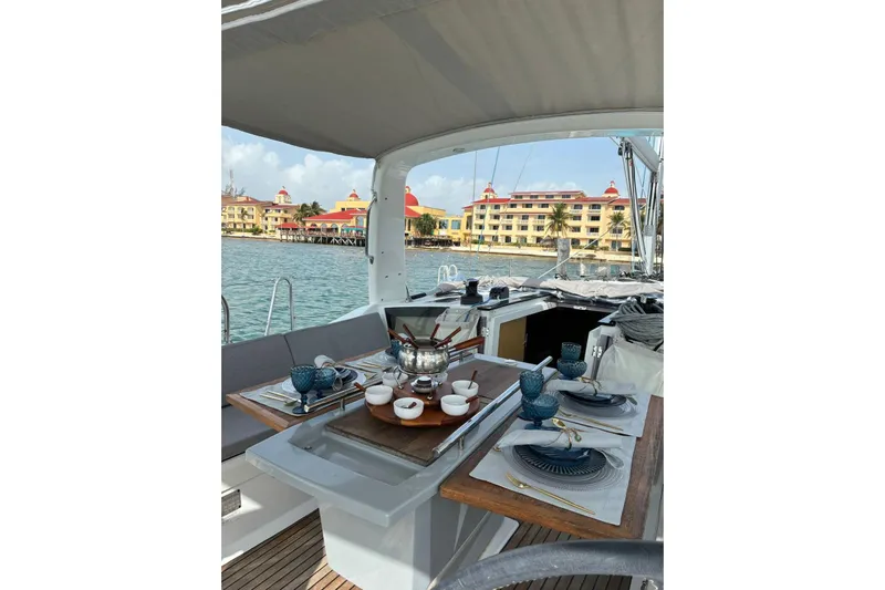  Yacht Photos Pics Beneteau Oceanis 41.1 yacht dining setup with waterfront view, 2020 model.