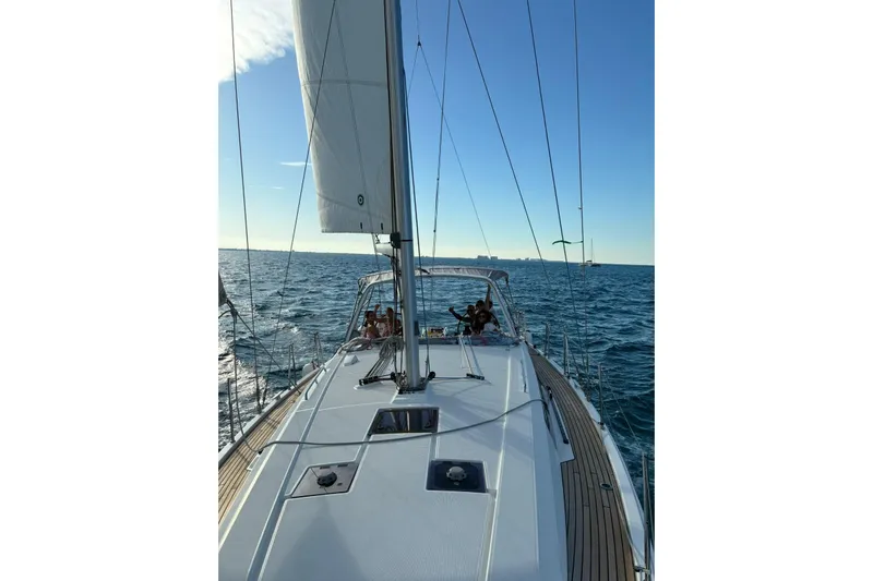  Yacht Photos Pics 2020 Beneteau Oceanis 41.1 sailing on open sea under clear blue sky.
