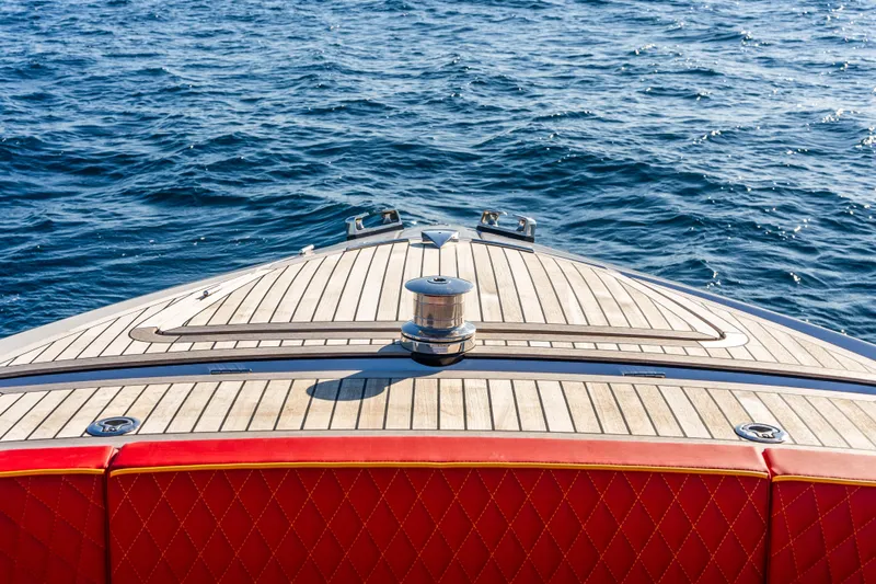  Yacht Photos Pics Bow of 2024 Frauscher 1414 Demon yacht with teak deck on open water.