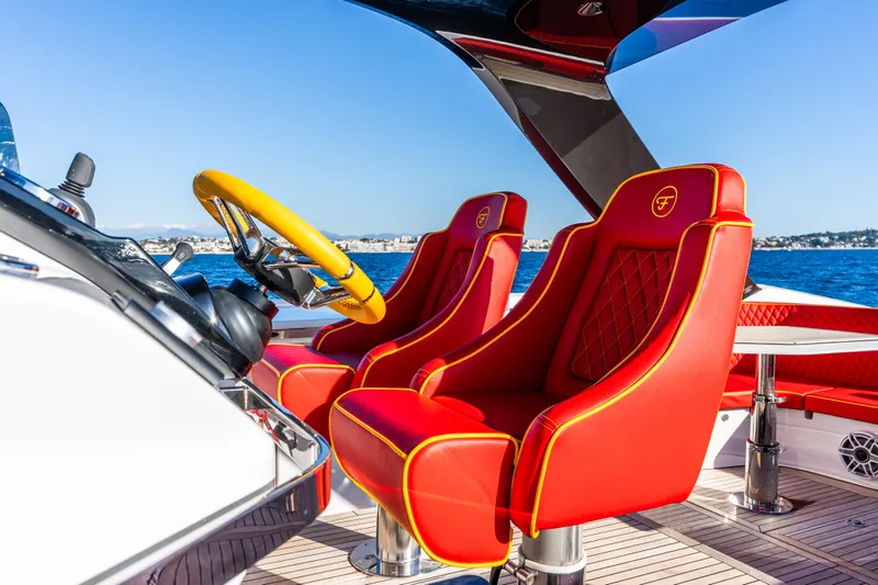  Yacht Photos Pics Luxury red seats and yellow steering wheel on 2024 Frauscher 1414 Demon yacht.