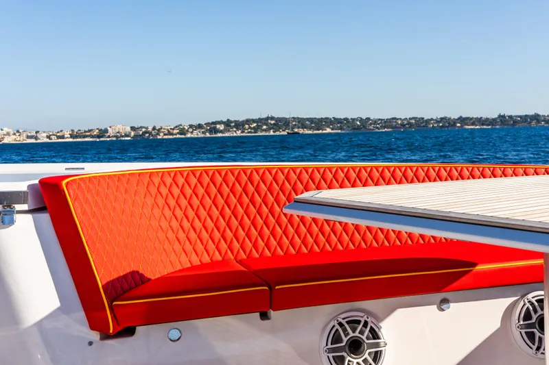  Yacht Photos Pics 2024 Frauscher 1414 Demon yacht with red quilted seating and ocean view.