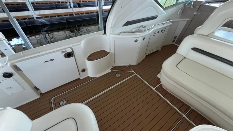  Yacht Photos Pics 2004 Sea Ray 420 Sundancer interior with teak flooring and white seating.