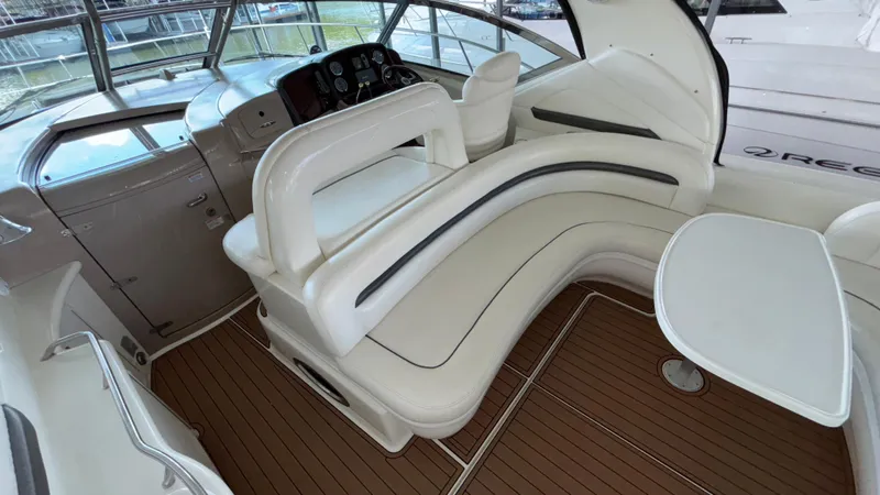  Yacht Photos Pics 2004 Sea Ray 420 Sundancer cockpit with white seating and wooden flooring.