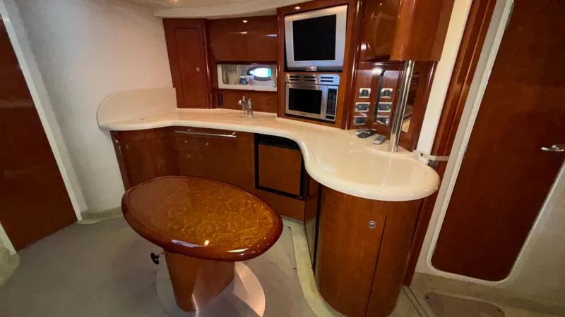  Yacht Photos Pics Luxurious interior of 2004 Sea Ray 420 Sundancer yacht with modern kitchen amenities.