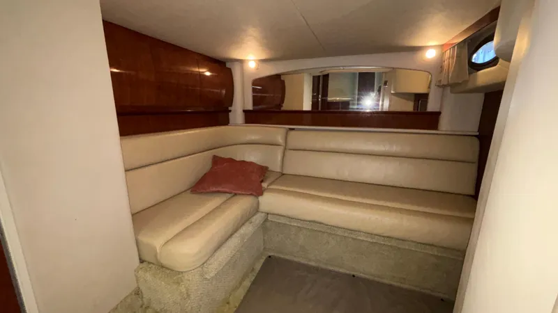  Yacht Photos Pics 2004 Sea Ray 420 Sundancer interior with beige seating and wooden accents.