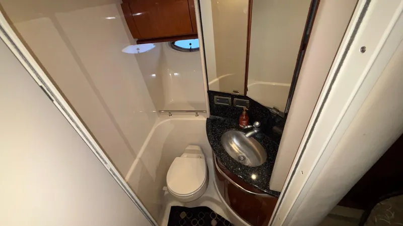  Yacht Photos Pics Bathroom interior of 2004 Sea Ray 420 Sundancer yacht with sink and toilet.