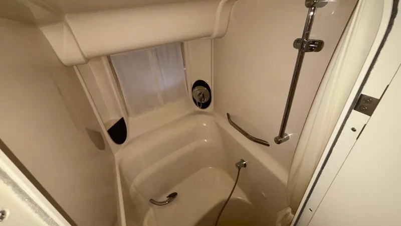  Yacht Photos Pics 2004 Sea Ray 420 Sundancer bathroom with shower and chrome fixtures.