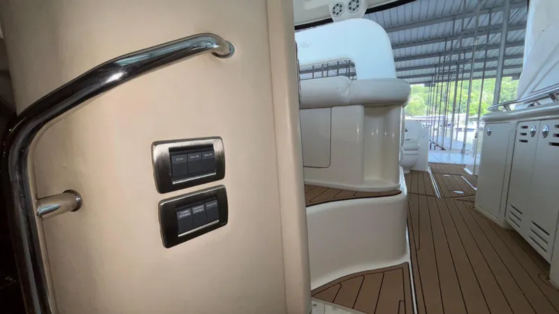  Yacht Photos Pics 2004 Sea Ray 420 Sundancer interior with control switches and teak flooring.