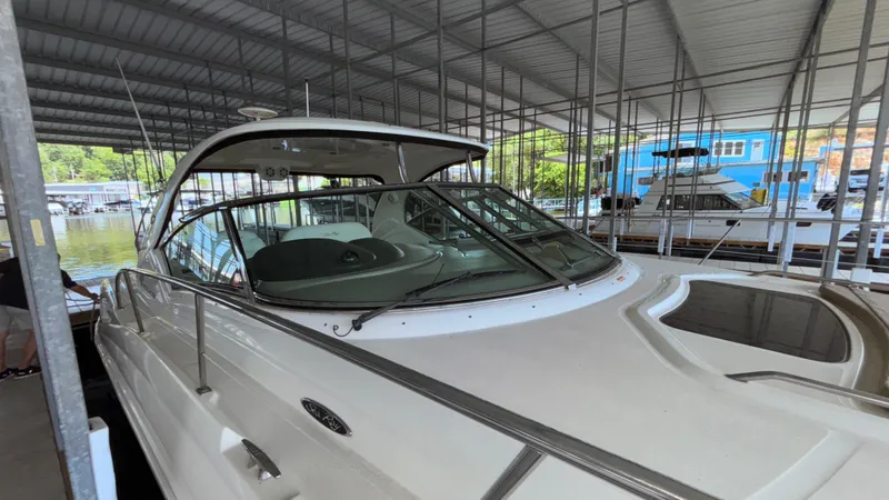  Yacht Photos Pics 2004 Sea Ray 420 Sundancer yacht docked in a covered marina.