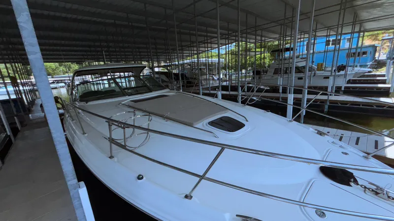  Yacht Photos Pics 2004 Sea Ray 420 Sundancer yacht docked in a covered marina.