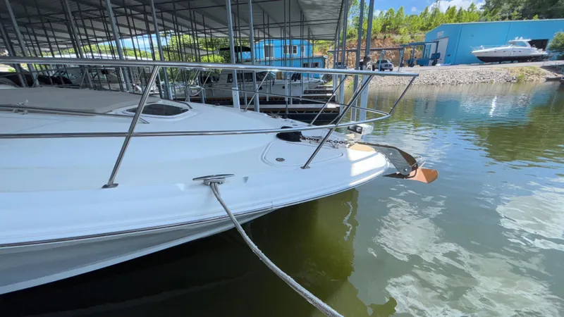  Yacht Photos Pics 2004 Sea Ray 420 Sundancer docked in a marina under a covered area.