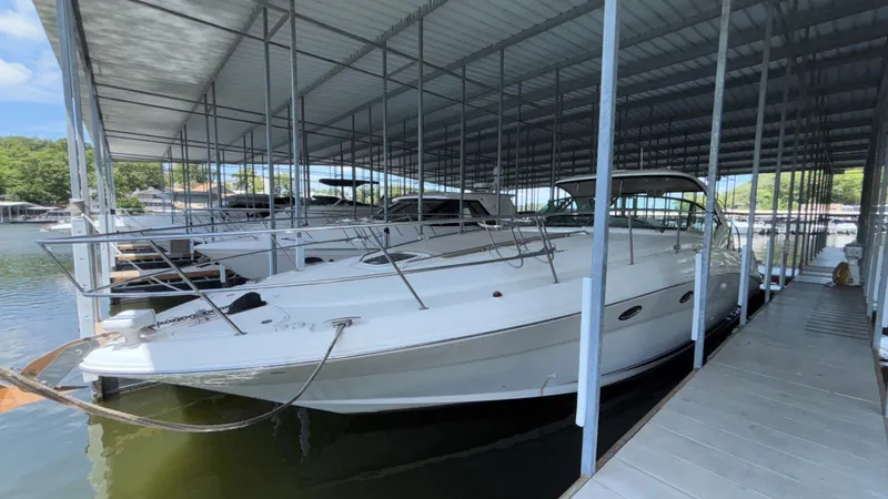  Yacht Photos Pics 2004 Sea Ray 420 Sundancer docked in a covered marina.