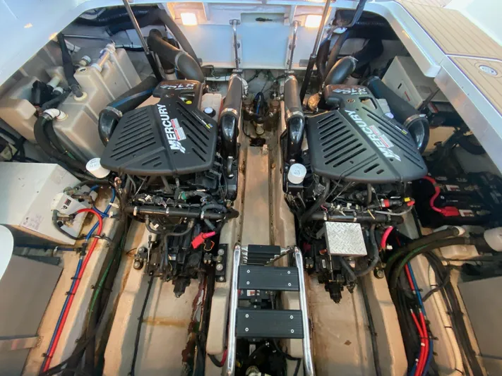  Yacht Photos Pics Engine room of 2004 Sea Ray 420 Sundancer with twin Mercury engines.