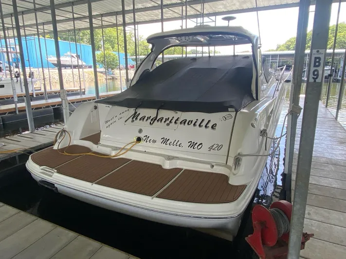  Yacht Photos Pics 2004 Sea Ray 420 Sundancer docked, rear view with "Margaritaville" text.