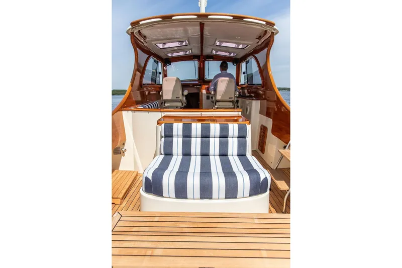 Admiralty Yacht Photos Pics 2005 Hinckley Picnic Boat EP with striped seating and wooden deck.