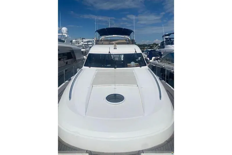  Yacht Photos Pics 2006 Princess 67 Flybridge Motor Yacht docked under clear blue sky.