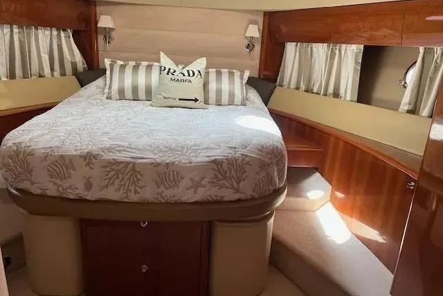  Yacht Photos Pics Luxurious bedroom interior of 2006 Princess 67 Flybridge Motor Yacht with elegant bedding.