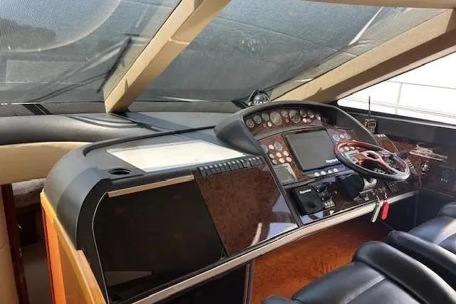  Yacht Photos Pics Interior helm of 2006 Princess 67 Flybridge Motor Yacht with modern navigation controls.