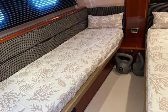  Yacht Photos Pics Interior of 2006 Princess 67 Flybridge Motor Yacht with twin beds and kettlebells.