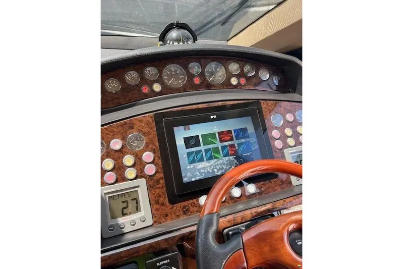  Yacht Photos Pics Control panel of 2006 Princess 67 Flybridge Motor Yacht with digital display and gauges.