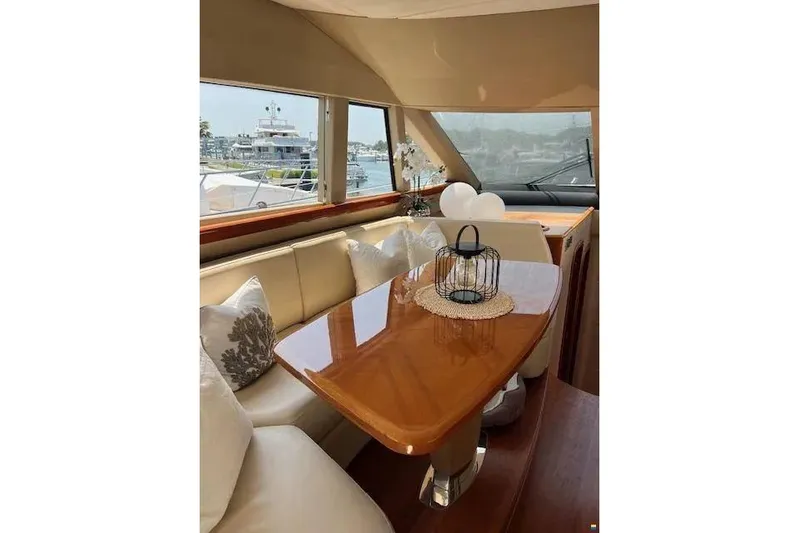  Yacht Photos Pics Luxurious interior of 2006 Princess 67 Flybridge Motor Yacht with elegant dining area.