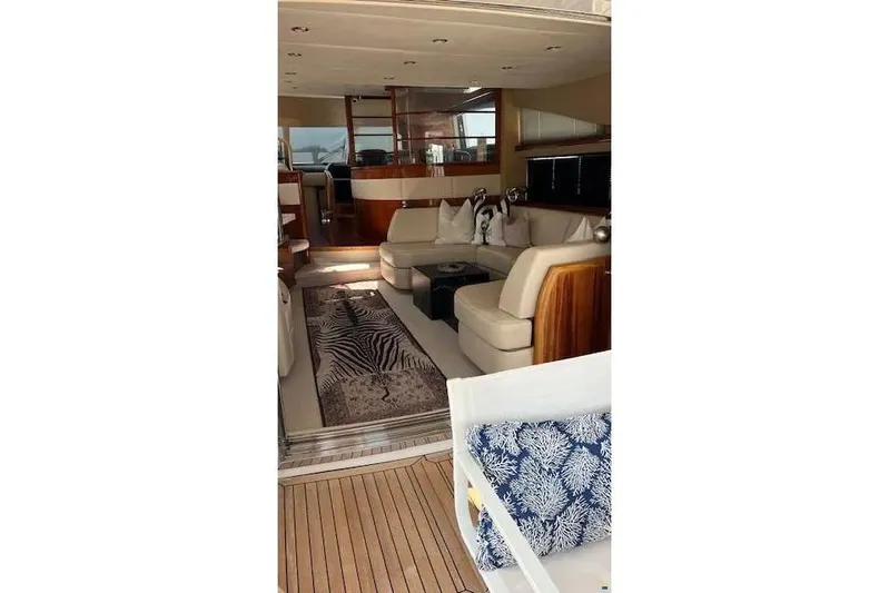  Yacht Photos Pics Luxurious interior of 2006 Princess 67 Flybridge Motor Yacht with elegant seating and decor.