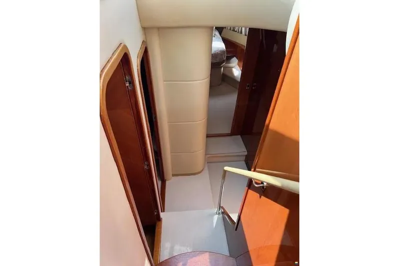  Yacht Photos Pics Interior view of 2006 Princess 67 Flybridge Motor Yacht, featuring elegant wood finishes and cozy cabin.