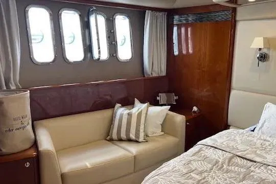  Yacht Photos Pics Luxurious interior of 2006 Princess 67 Flybridge Motor Yacht with sofa and bed.