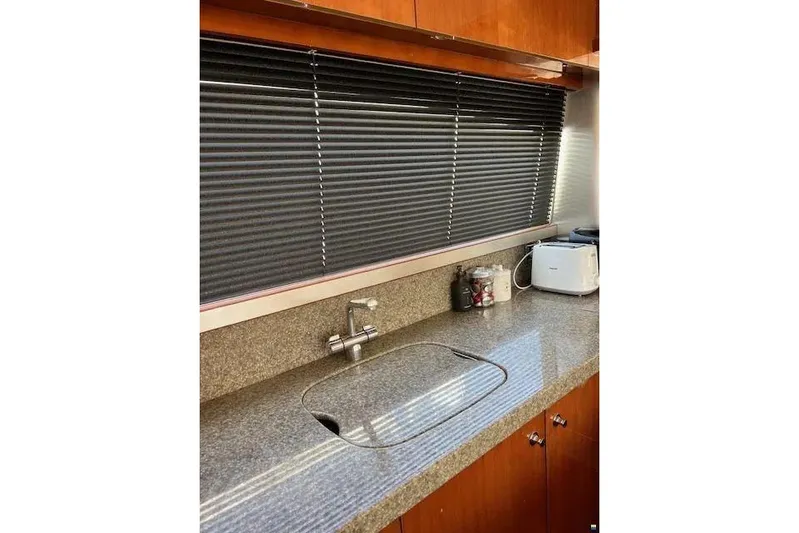  Yacht Photos Pics Kitchen area of 2006 Princess 67 Flybridge Motor Yacht with granite countertop and appliances.