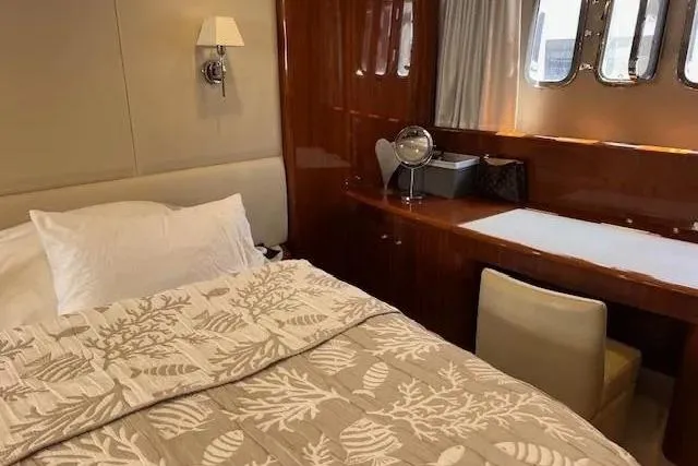  Yacht Photos Pics Luxurious bedroom interior of 2006 Princess 67 Flybridge Motor Yacht with elegant decor.