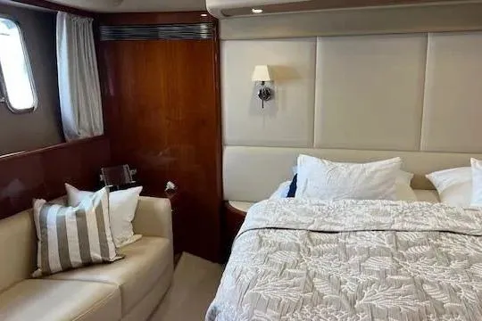  Yacht Photos Pics Luxurious bedroom interior of 2006 Princess 67 Flybridge Motor Yacht with elegant decor.