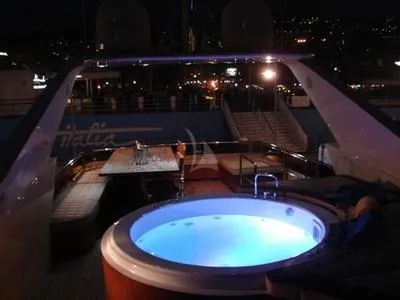  Yacht Photos Pics Luxurious Tecnomar NADARA 80 flybridge yacht with illuminated jacuzzi at night, 2008 model.