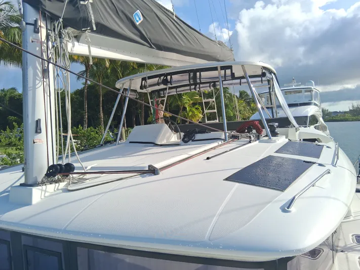 Paper Doll Yacht Photos Pics 2019 Lagoon 450 F catamaran docked, featuring sleek design and modern rigging.