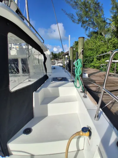 Paper Doll Yacht Photos Pics 2019 Lagoon 450 F catamaran docked, showing deck and mooring lines.
