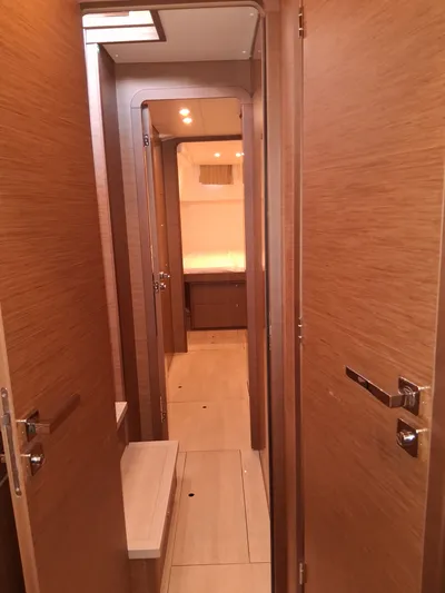 Paper Doll Yacht Photos Pics Interior hallway of a 2019 Lagoon 450 F yacht with wooden finishes.
