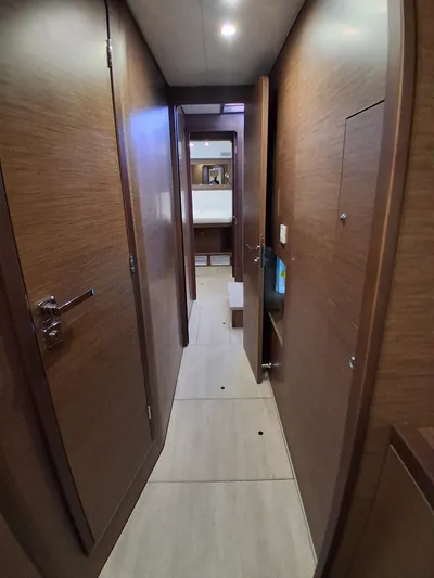 Paper Doll Yacht Photos Pics Interior hallway of 2019 Lagoon 450 F yacht with wooden finish.