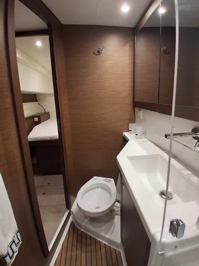 Paper Doll Yacht Photos Pics Modern bathroom interior on a 2019 Lagoon 450 F yacht, featuring sleek design elements.